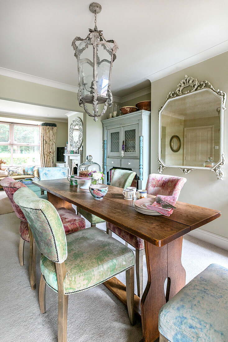 Crushed velvet dining chairs and vintage wooden table in Victorian terrace Alton UK