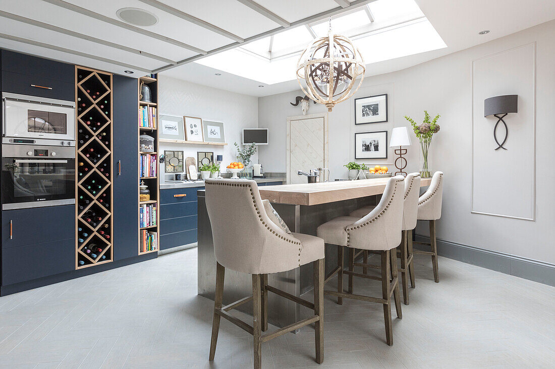 Limed oak breakfast bar with stools in Victorian terrace Wandsworth London Uk