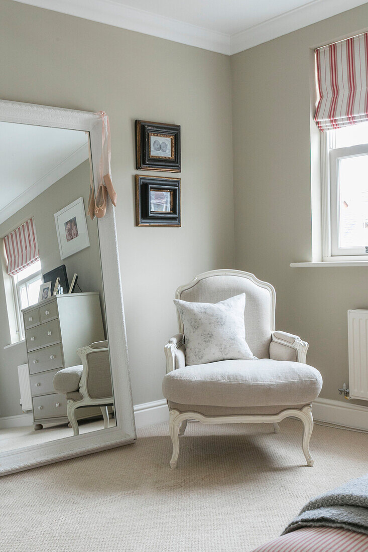 Reupholstered armchair and full length mirror in Guildford townhouse Surrey UK