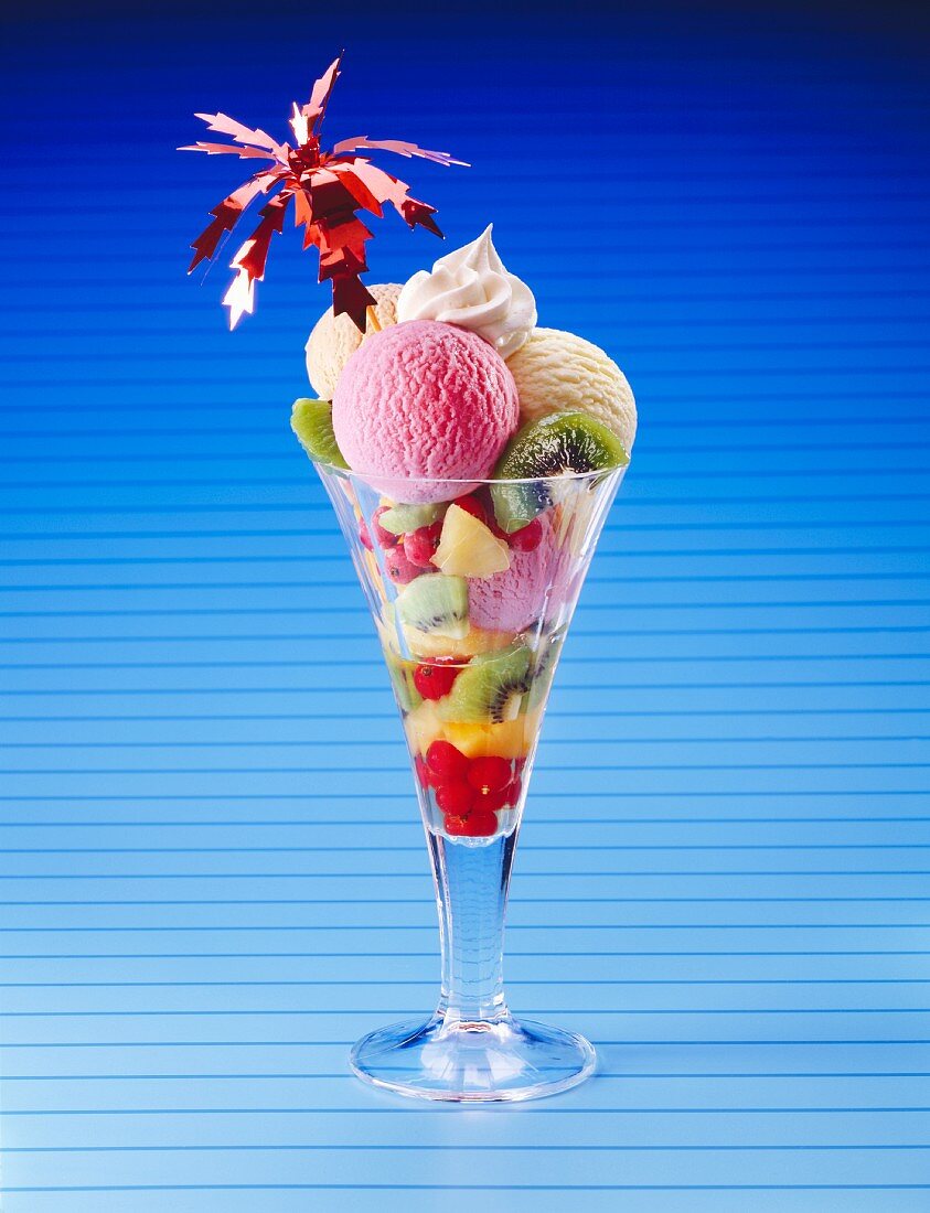 Ice cream sundae with fresh fruit and cream