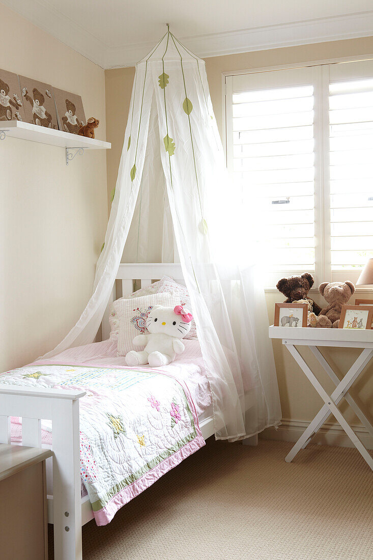 Single bed at window of girl's bedroom in Sydney home Australia