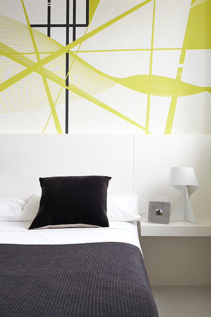 Abstract wallpaper in bedroom of contemporary Coombe home, England, UK