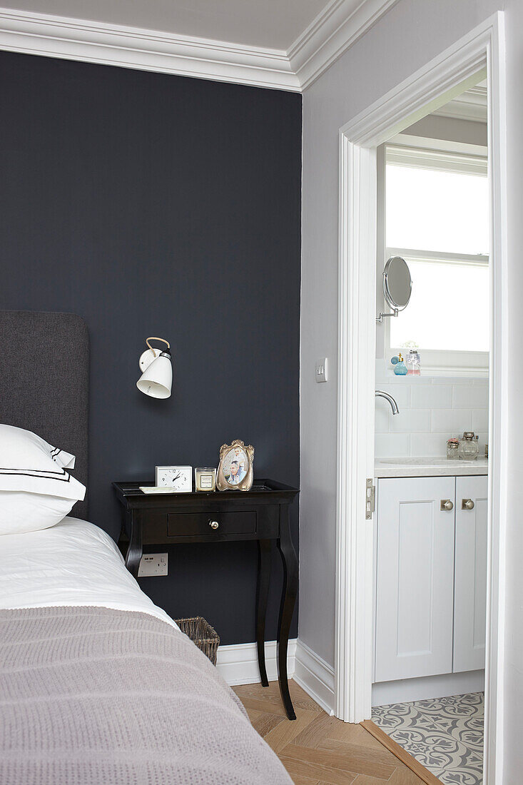 Bedside table with wall in Railings and door to ensuite Buckinghamshire UK