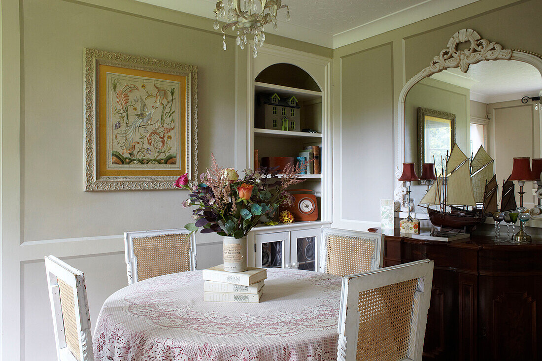 Framed artwork and model boat in dining room of East Cowes home, Isle of Wight, UK