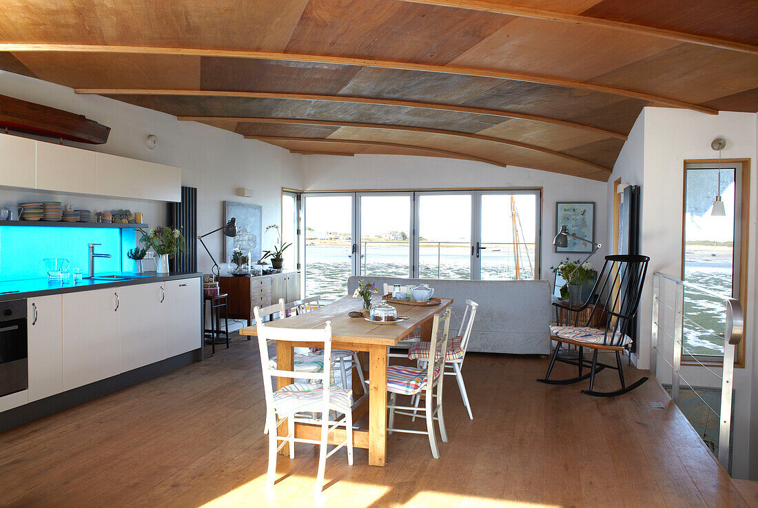 Open plan dining room kitchen on Bembridge houseboat Isle of Wight, UK