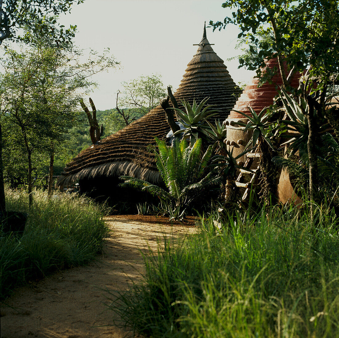 Garden view with thatched clay buildings