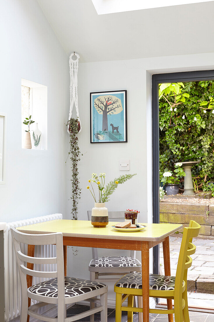 Table and chairs at backdoor in London kitchen renovation UK