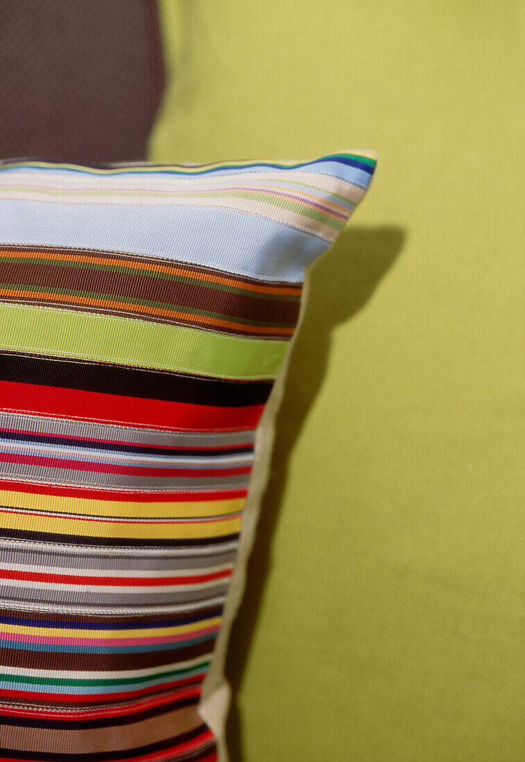 Brightly coloured striped cushion detail