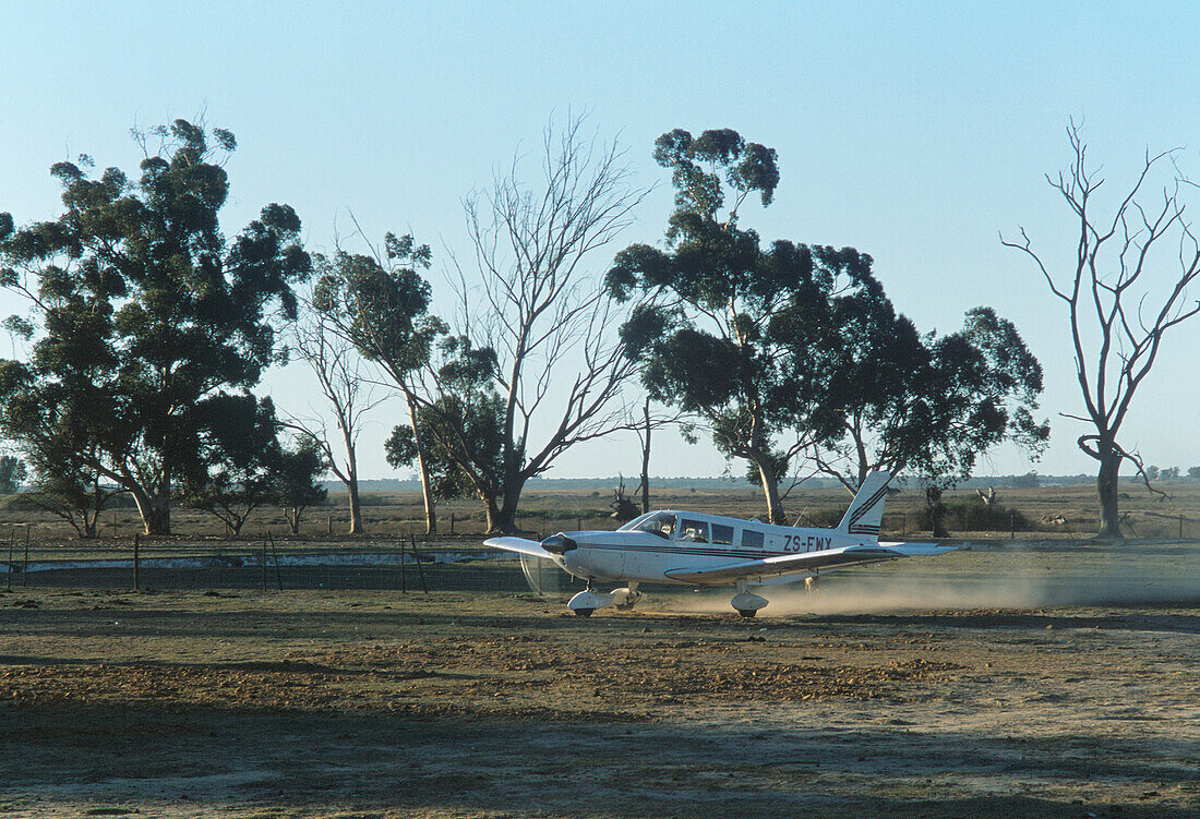 Light aircraft on landing strip