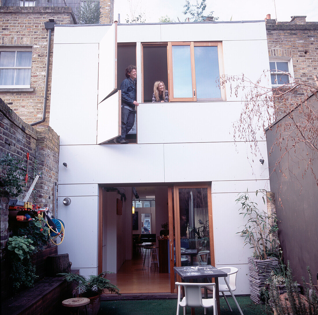 Exterior of modernized town house and garden with extension