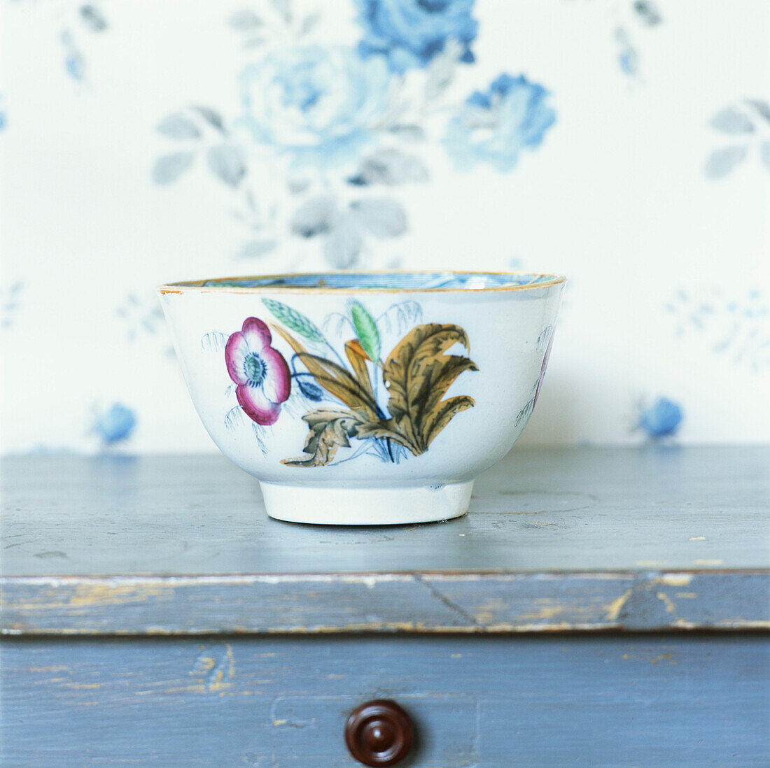 Ornate pottery on cupboard