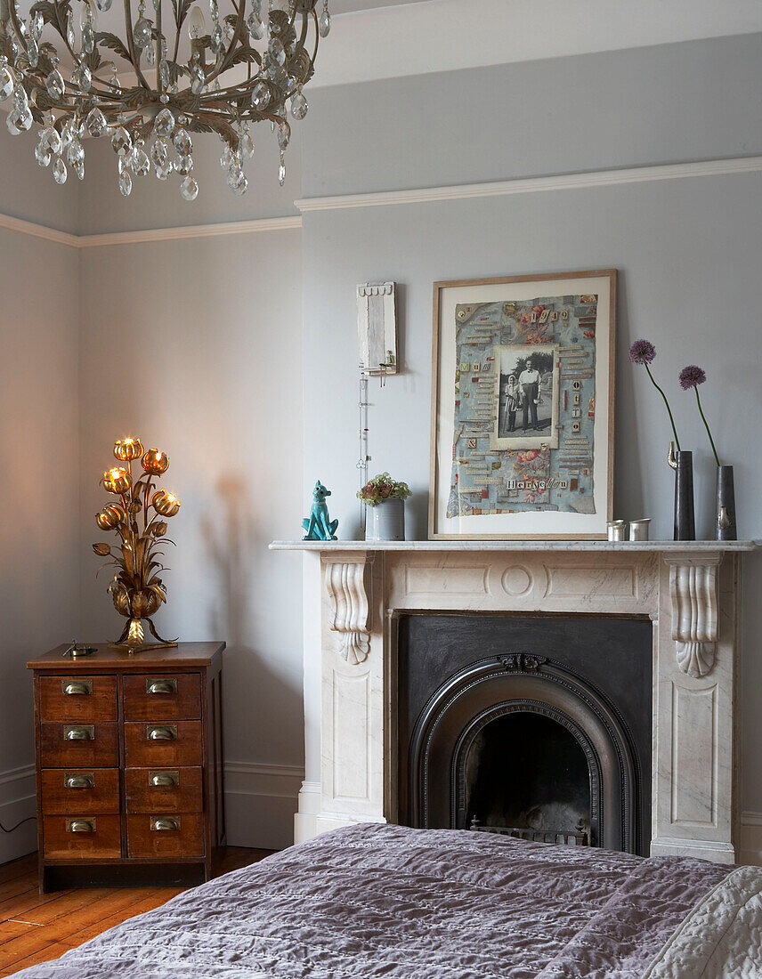 Bedroom detail with antique furnishings in London townhouse, UK