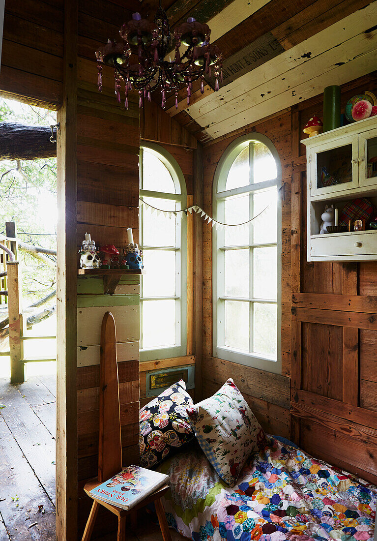 View through doorway of wood panelled Rye treehouse, East Sussex, England, UK