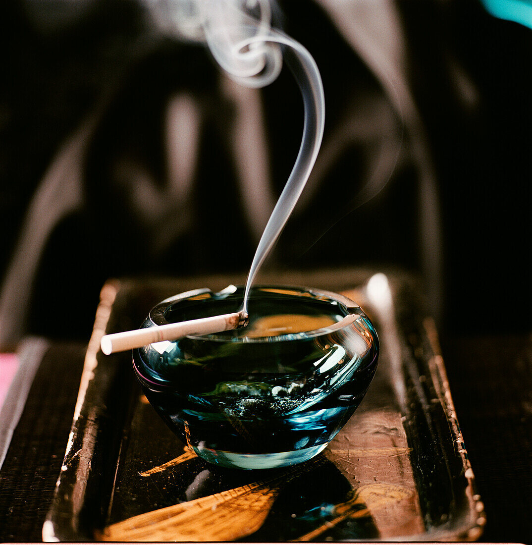 Cigarette smoking in an ashtray