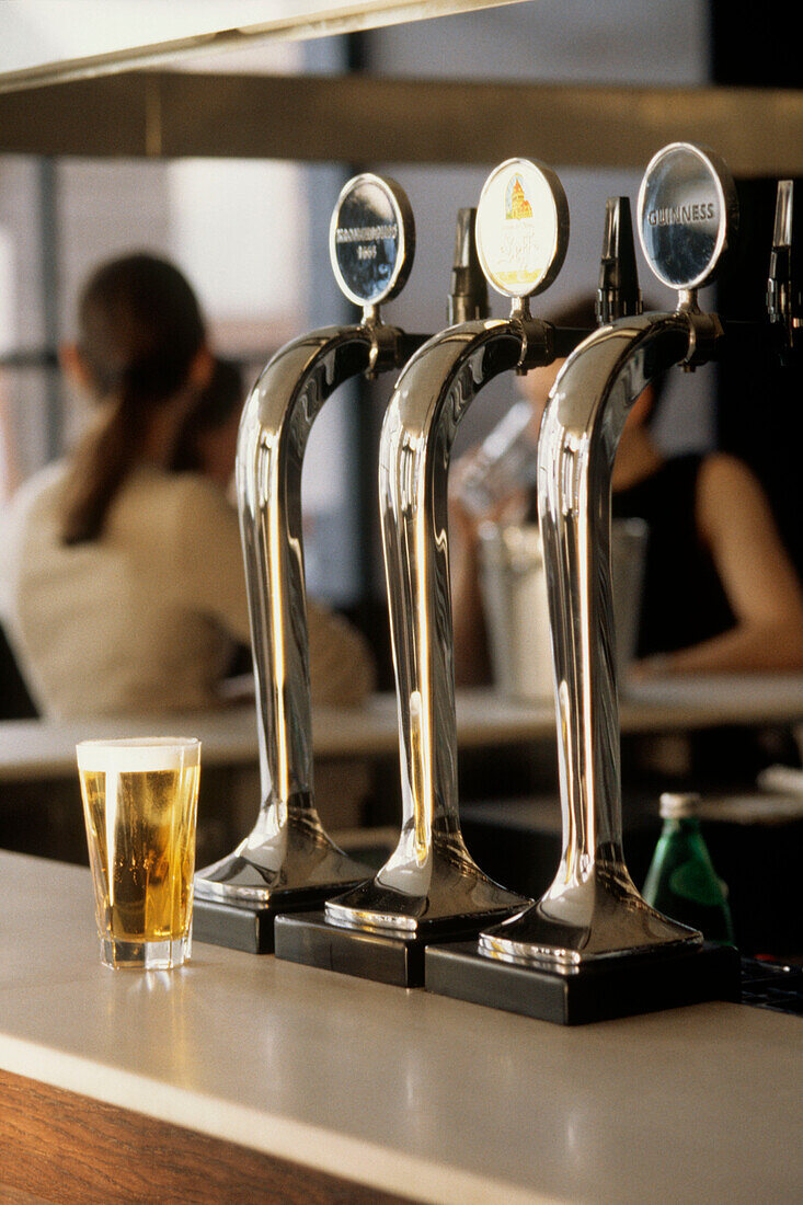 Bar with beer pumps and glasses of beer