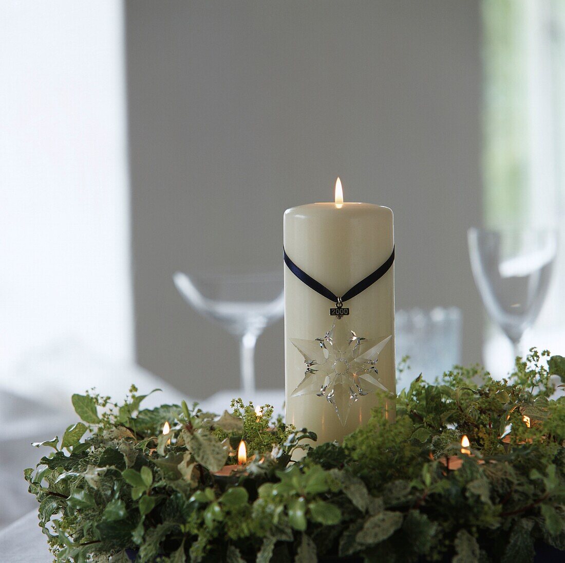 Christmas wreath with burning candles and crystal star