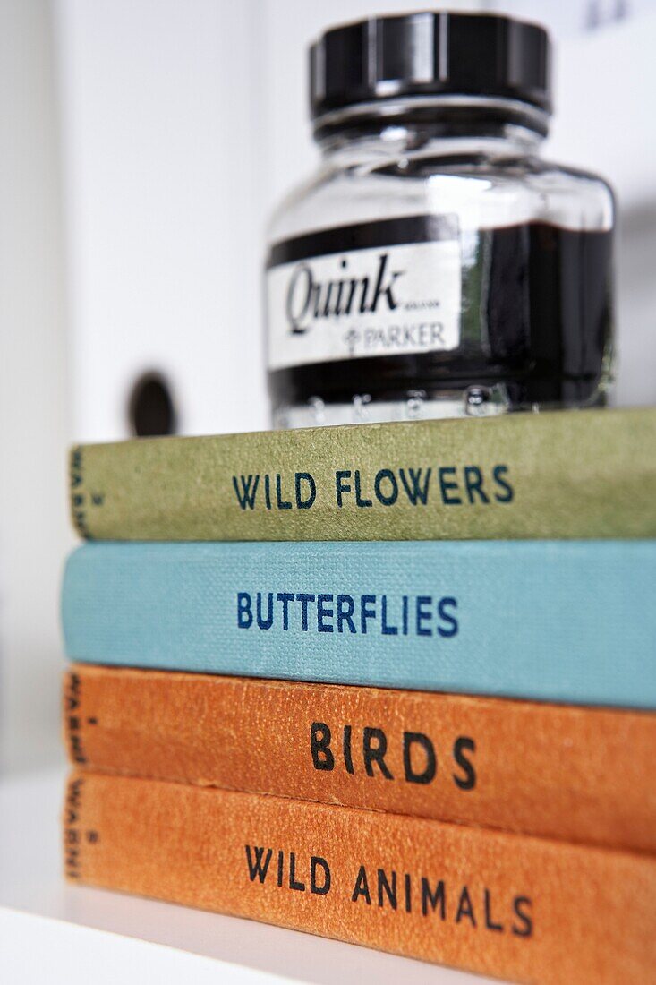 Writing ink with books on nature