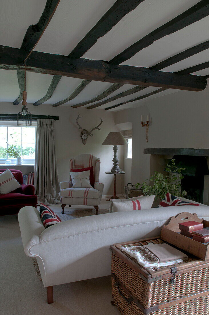 Beamed ceiling with striped fabrics in living room of Kingston home,  East Sussex,  England,  UK