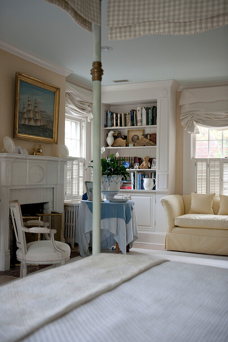 Bookcase in bedroom of Washington DC DC home,  with four postered bed,  USA