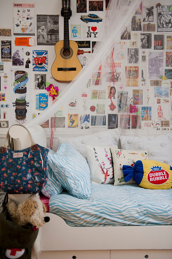 Single bed and artwork with guitar in child's room of Bordeaux apartment building,  Aquitaine,  France