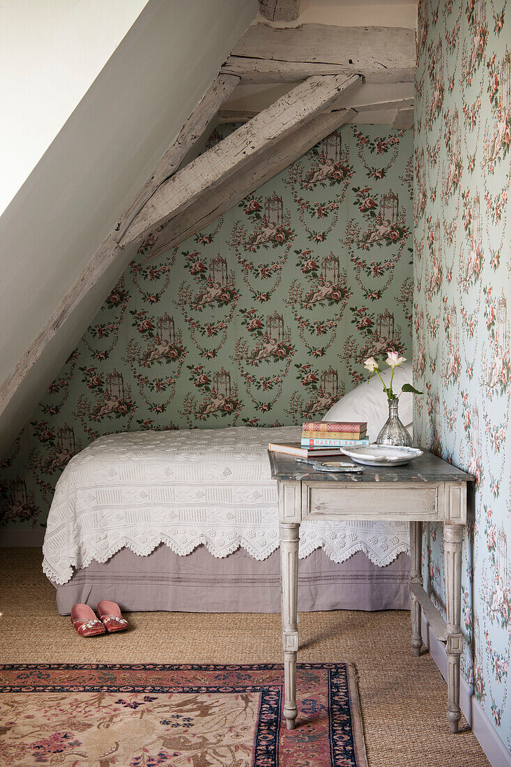 Single bed in timber framed and papered bedroom of Dordogne cottage  Perigueux  France