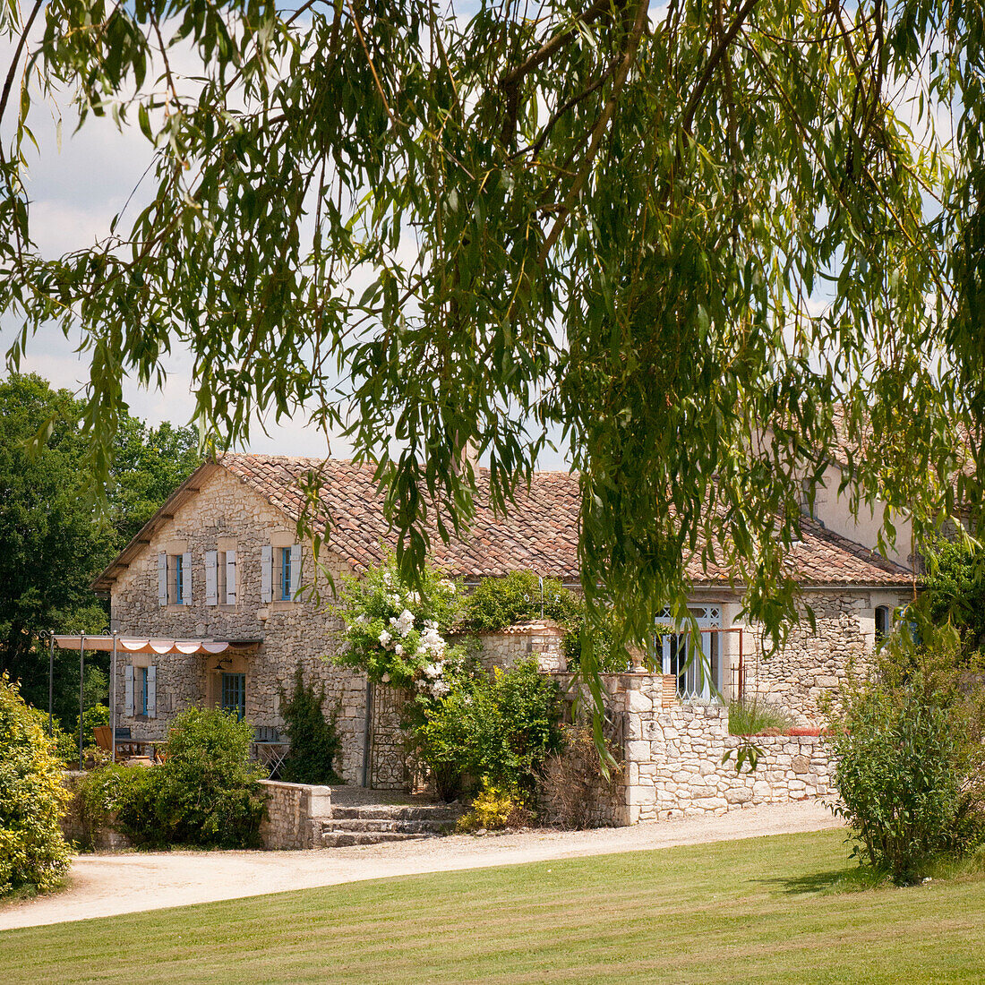 Awning over terrace on stone barn conversion in Lotte et Garonne  France