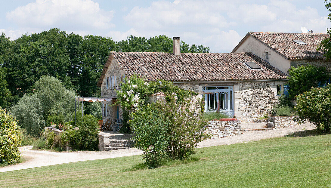 Tiled roof and grounds of Lotte et Garonne farmhouse  France