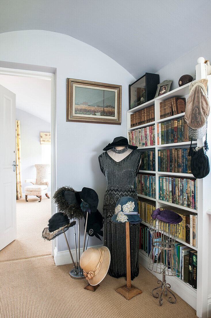 Vintage dress and hats with books in Norfolk coastguards cottage  England  UK