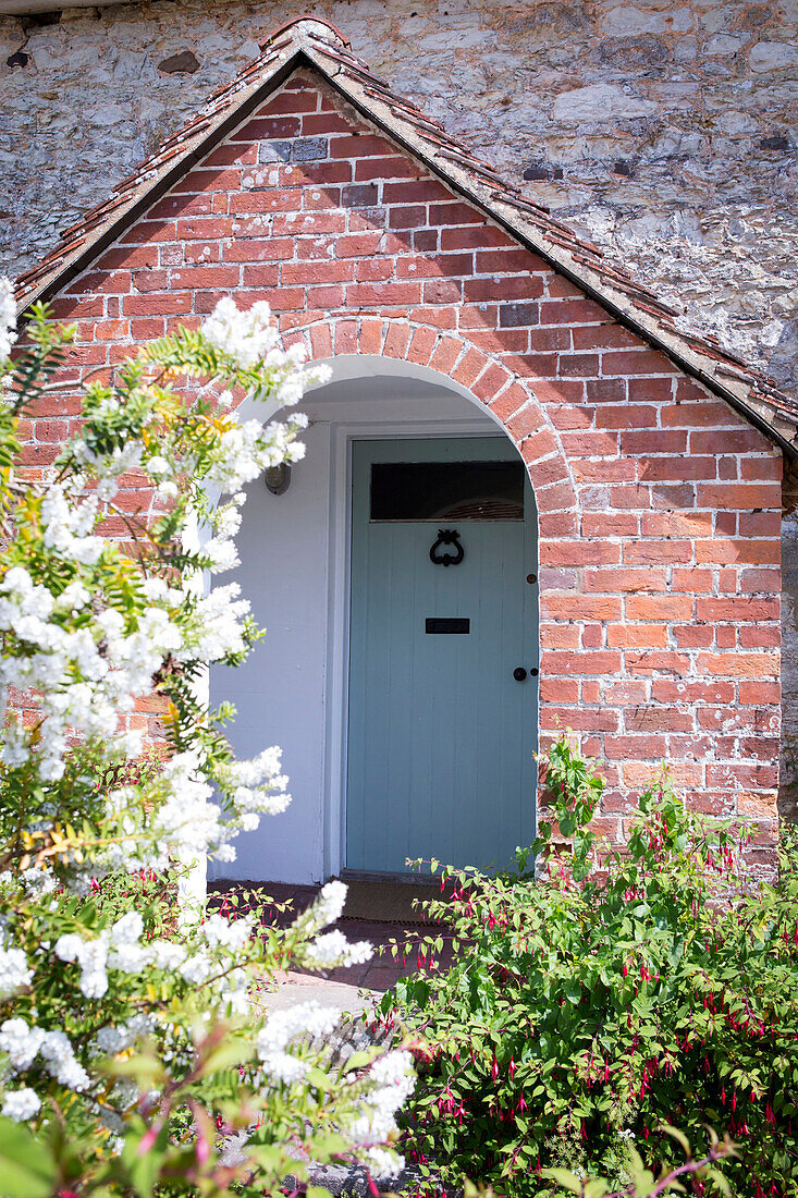 Arched brick porch of Petworth home England UK