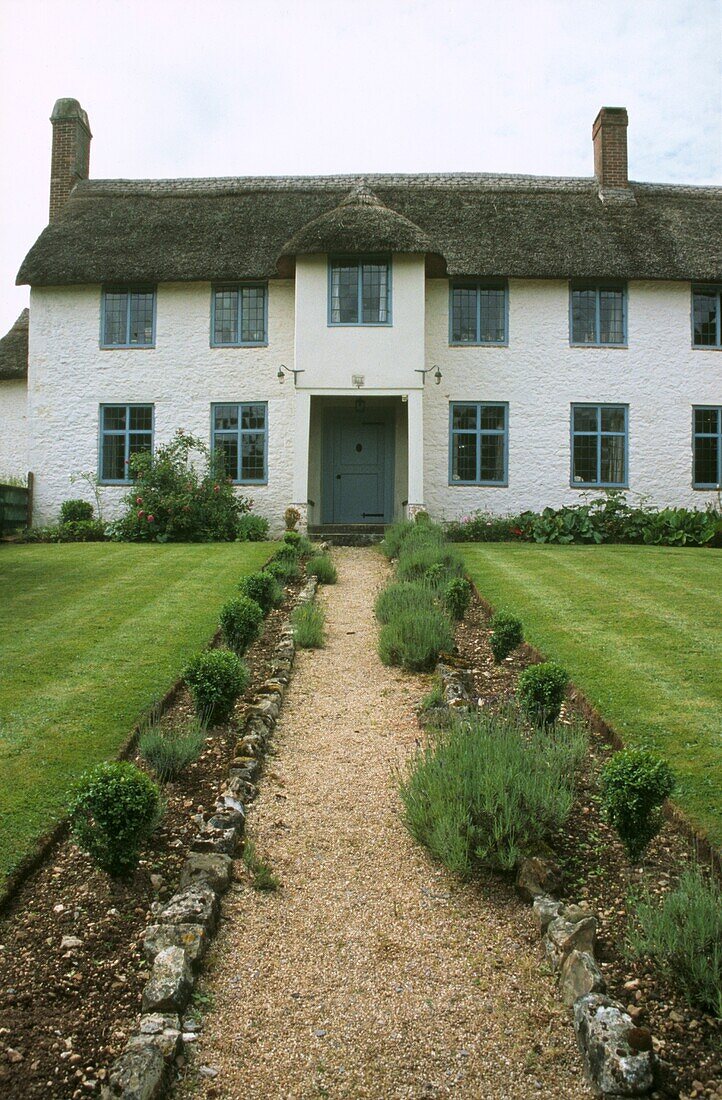 Garden path to thatched farmhouse