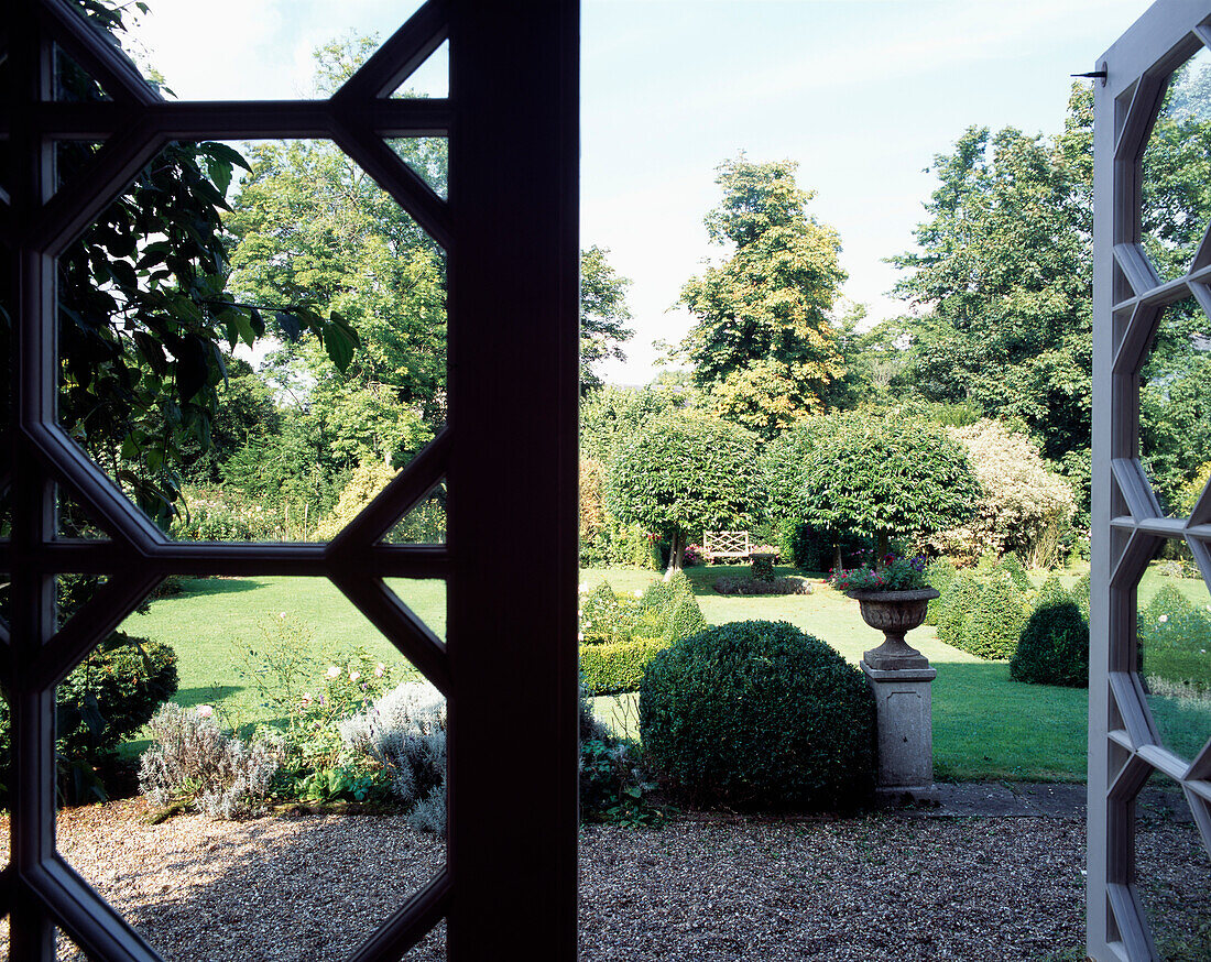 View through open door to 16th century Suffolk house garden