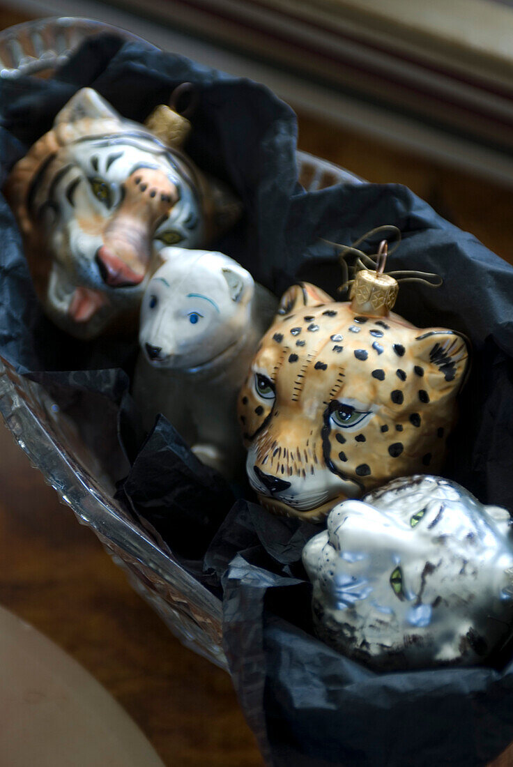 Detail of hand blown Polish glass animal christmas decorations including a tiger polar bear leopard and snow leopard
