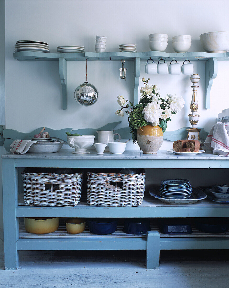 Crockery on kitchen shelf