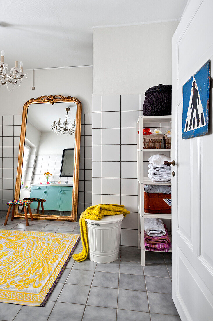 Full length mirror and shelving unit in bathroom of modern Odense family home Denmark