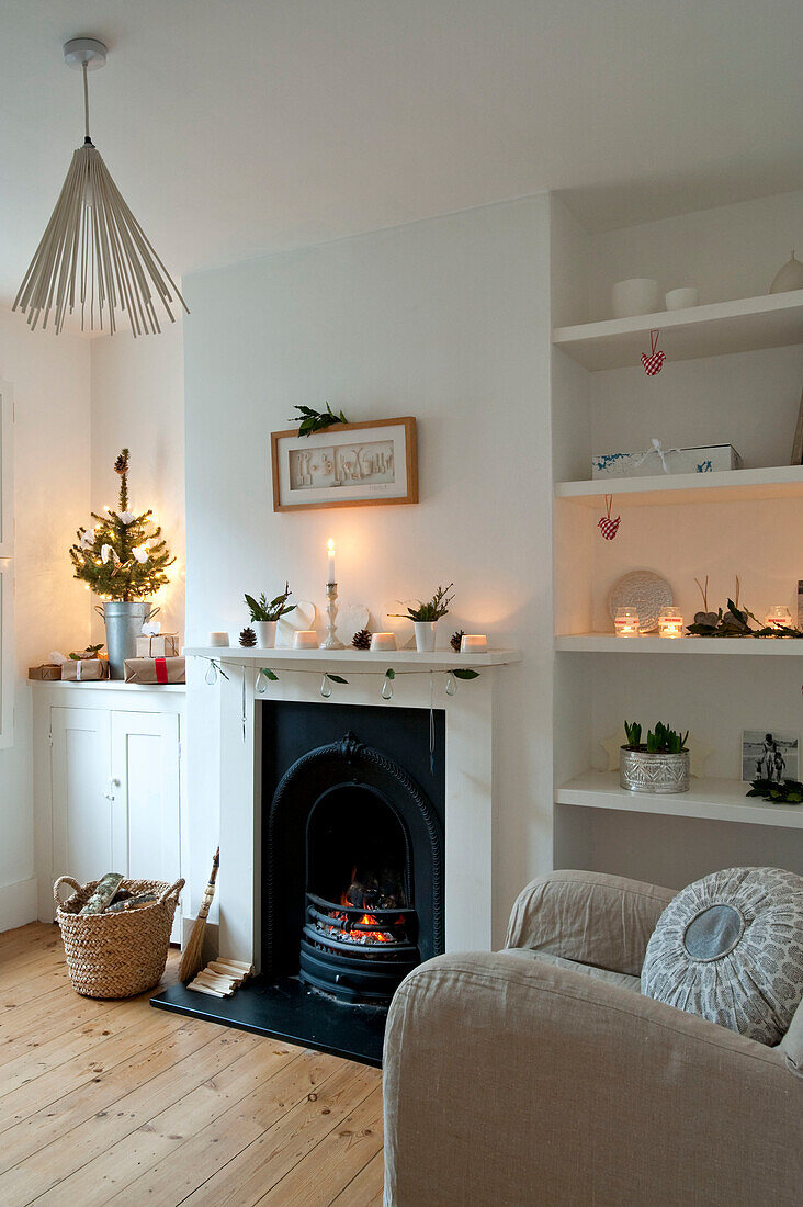 Neutral Christmas living room with original fireplace in Richmond-on-Thames London