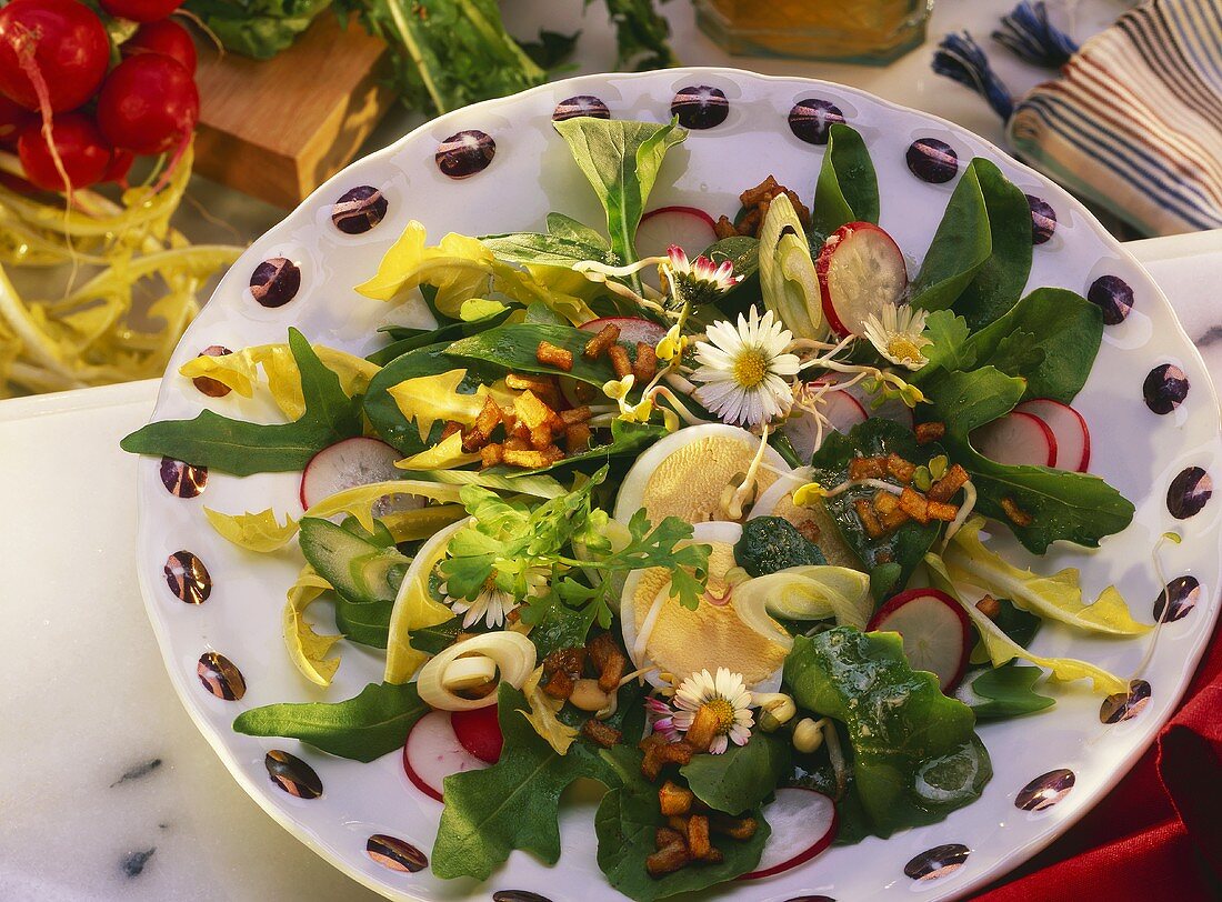 Mixed salad leaves with radishes, eggs & daisies