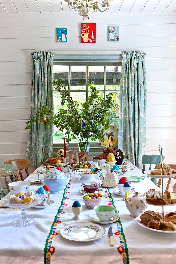 Spring blossom at window of Easter table in Essex home, England, UK