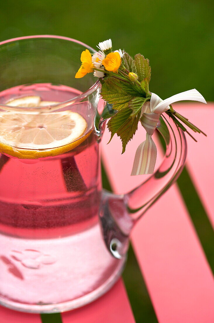 Jug of pink lemonade on table in Brecon, Powys, Wales, UK