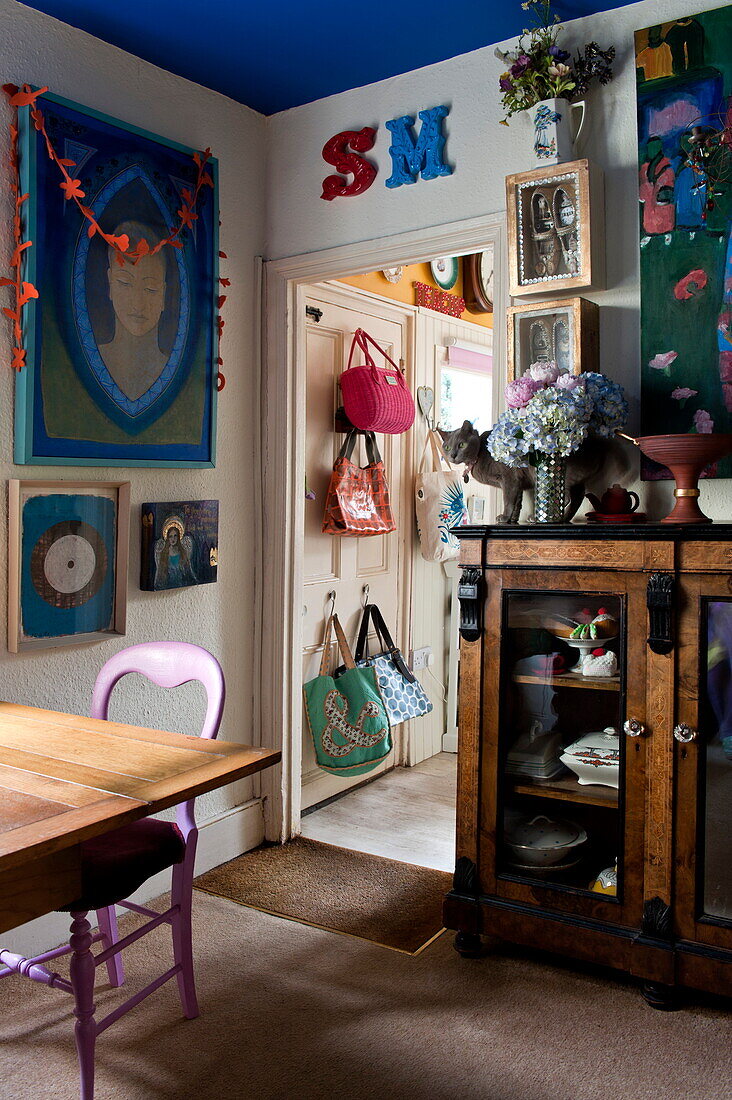 Bags and artwork displayed in London home, England, UK