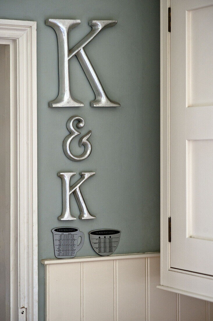 Wall mounted letters K in kitchen of contemporary Suffolk/Essex home, England, UK