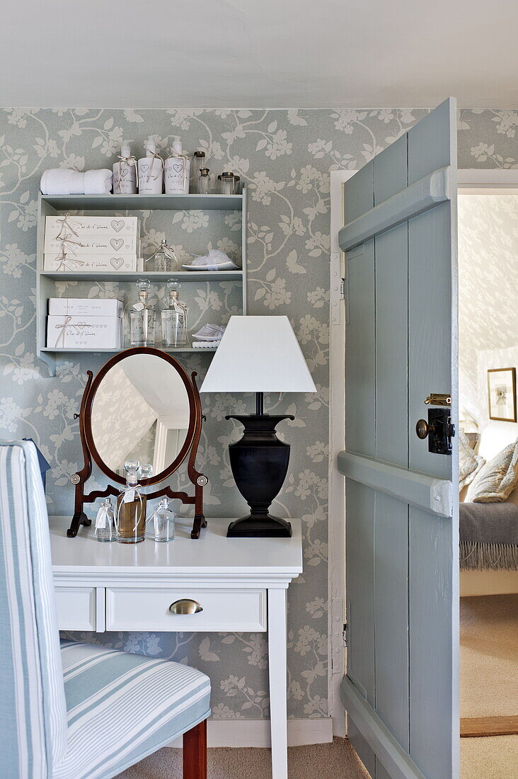 Dressing table and chair in attic bathroom of Bury St Edmunds country home, Suffolk, England, UK