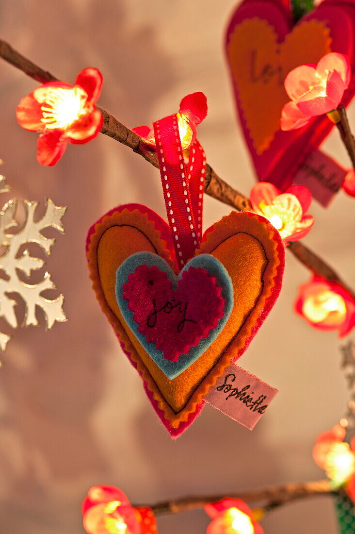 Heart shaped decoration with single word 'joy' in Penzance cottage Cornwall England UK