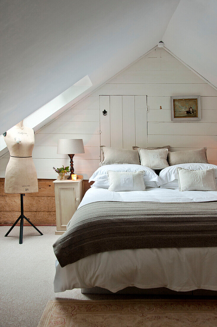 Tailors dummy below skylight in attic bedroom in Sherford barn conversion Devon UK