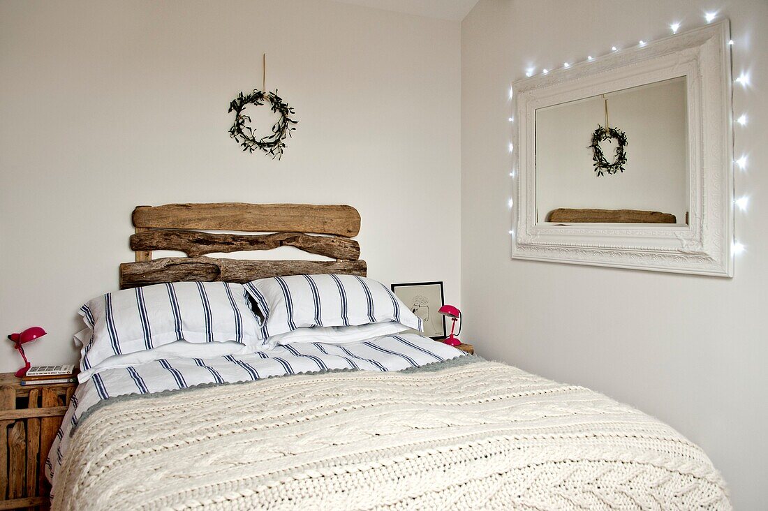 Driftwood headboard on double bed in Wadebridge home North Cornwall UK