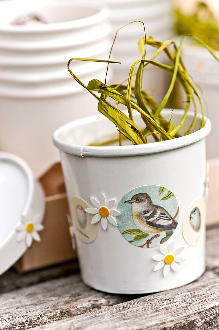 Easter gifts tied with string on bench seat in Sussex garden England UK