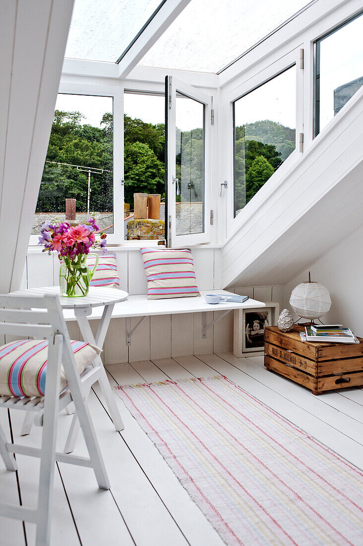 Window seat in attic conversion of family townhouse Cornwall England UK