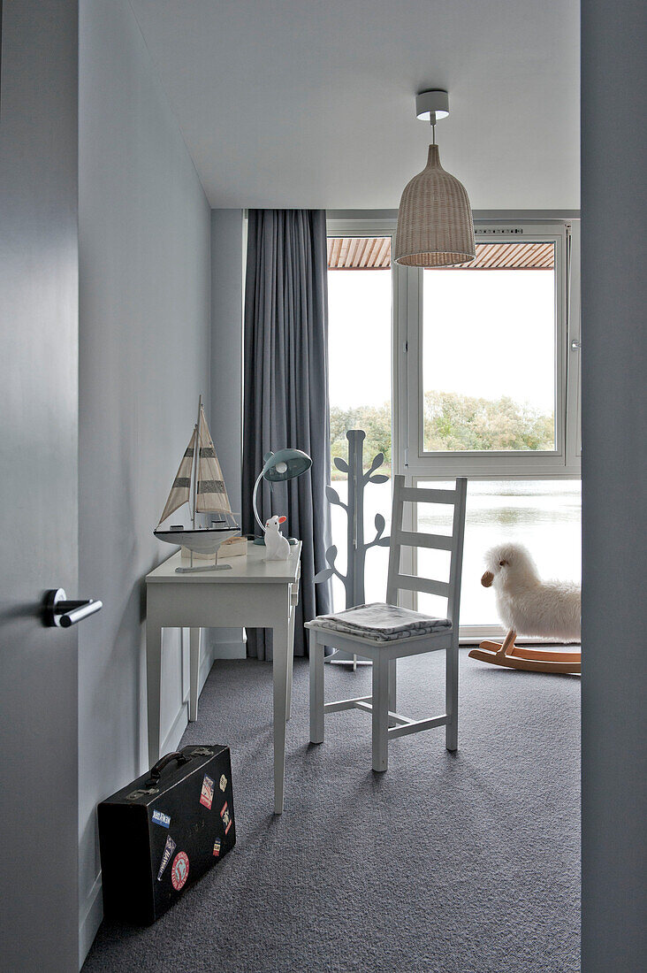 Desk and chair with rocking sheep in room of Lechlade home Gloucestershire England UK