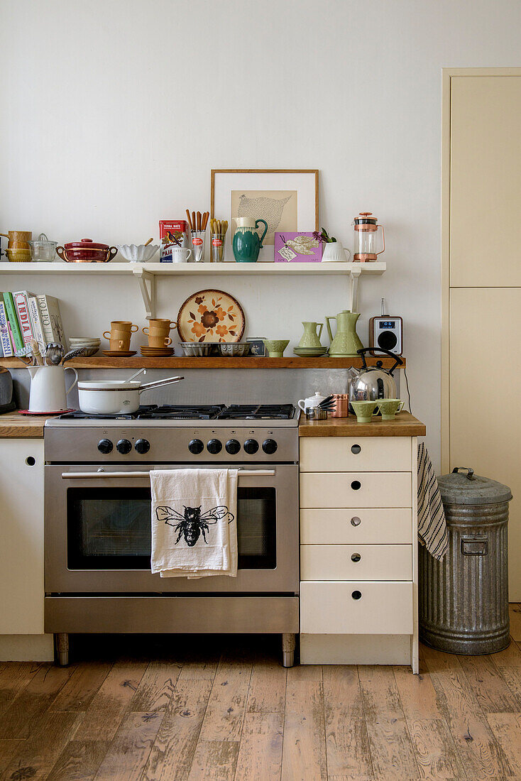 Stainless steel oven and shelving with metalbin in London kitchen UK