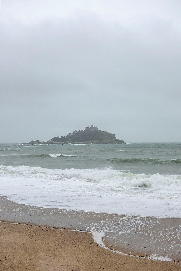 Coastal island view from beach in Marazion Cornwall UK