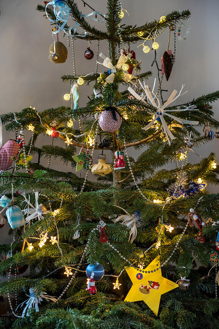 Handmade Christmas tree decorations with flowers made from plastic bottles Cornwall UK